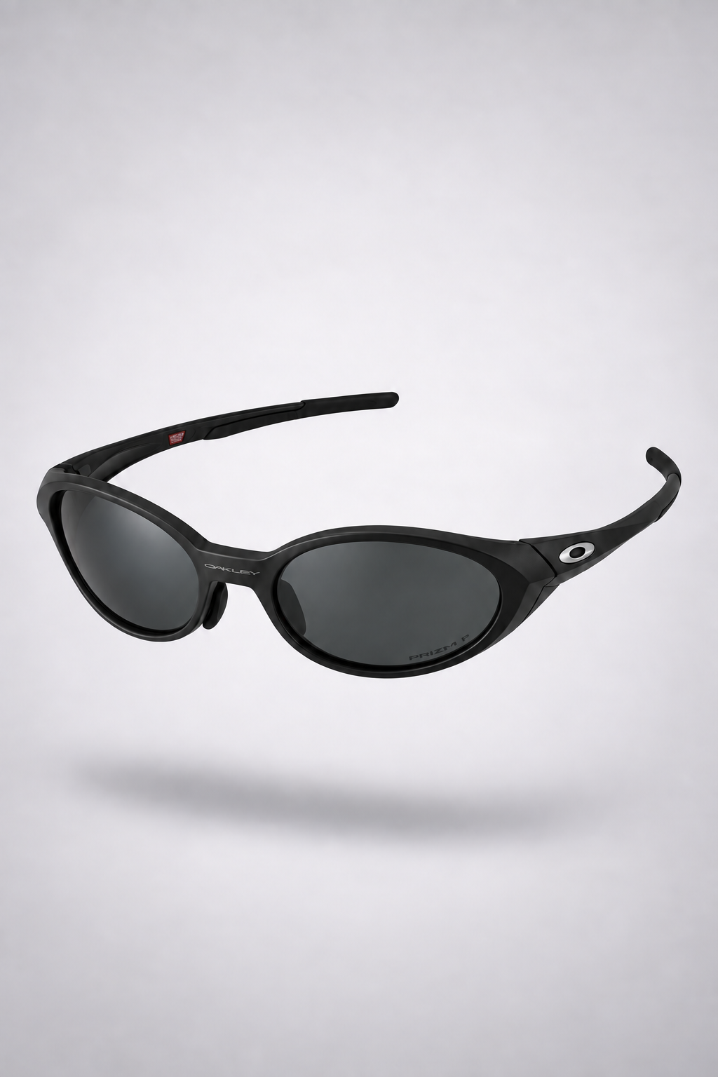 Oakley Eye Jacket Y2K — Matte Black sunglasses, front three-quarter view on a light gray studio background