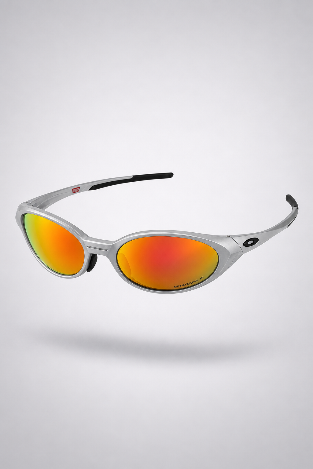 Oakley Eye Jacket Y2K — Silver / Fire Iridium sunglasses, front three-quarter view on a light gray studio background