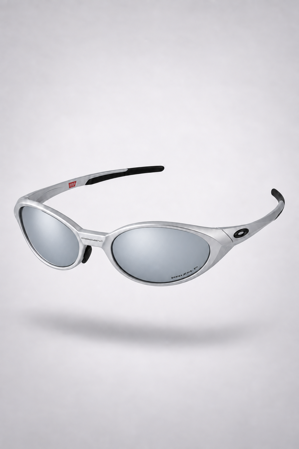 Oakley Eye Jacket Y2K — Silver / Mirror sunglasses, front three-quarter view on a light gray studio background